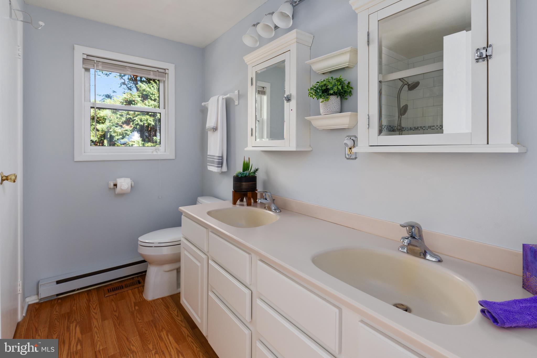 211 St Marys Road Baltimore, MD 21221 - Photo 41 of 50 a bathroom with a toilet sink and mirror