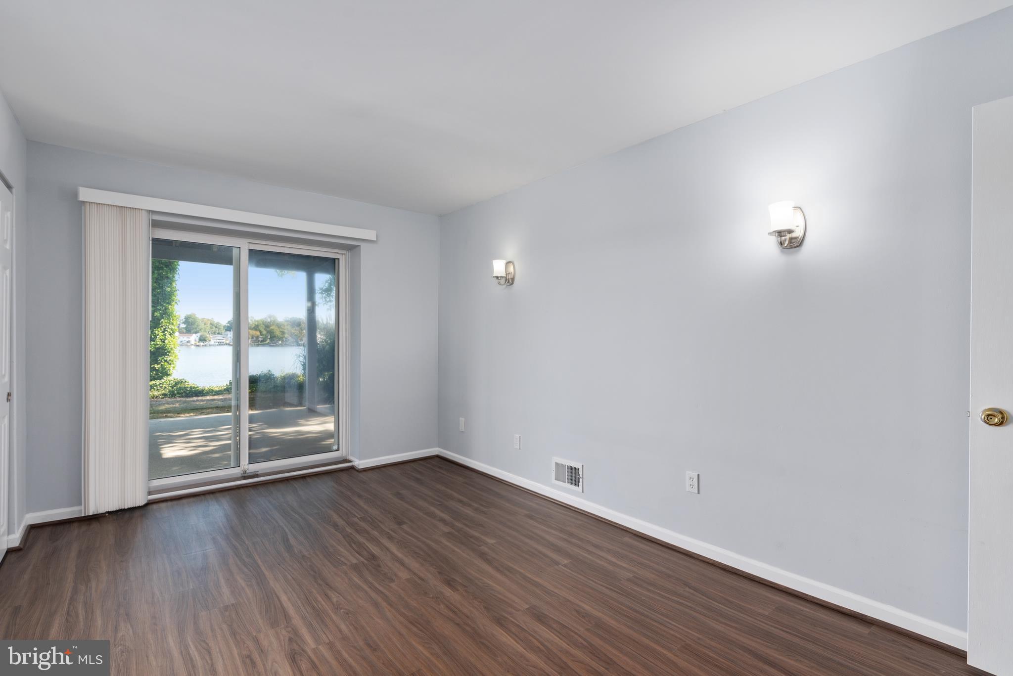 211 St Marys Road Baltimore, MD 21221 - Photo 44 of 50 wooden floor in an empty room with a window