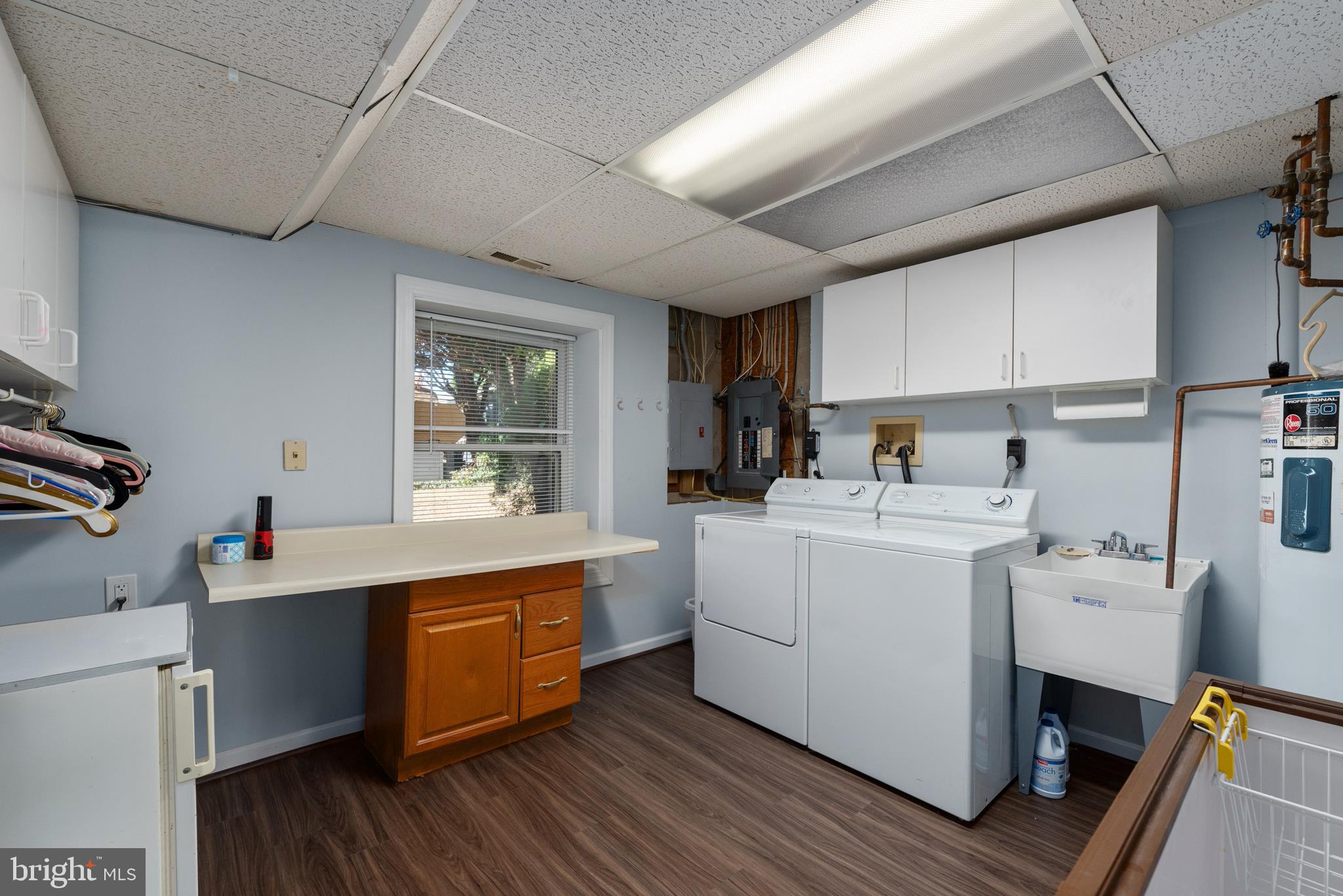 211 St Marys Road Baltimore, MD 21221 - Photo 48 of 50 a kitchen with sink cabinets and wooden floor
