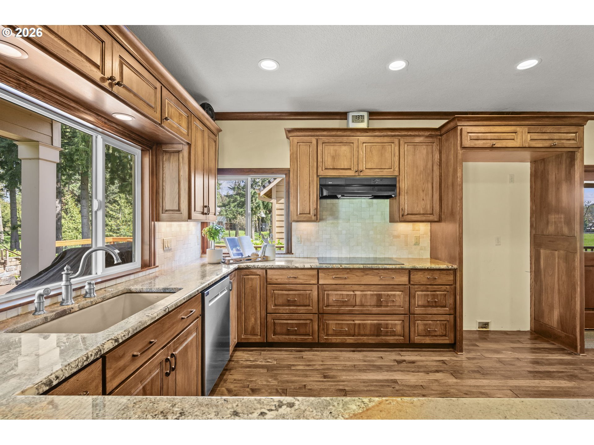 8121 South Vale Garden Road Canby, OR 97013 - Photo 12 of 48 a kitchen with kitchen island a sink stainless steel appliances and cabinets