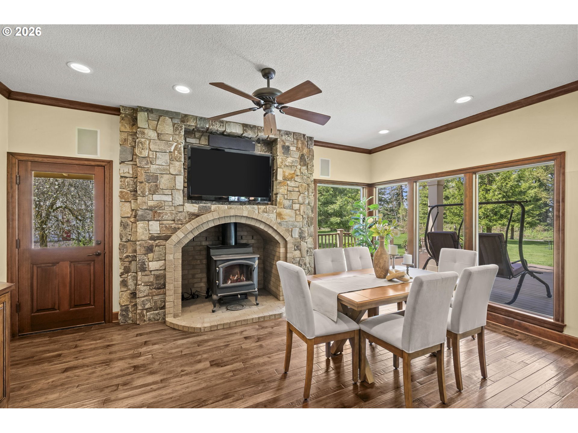 8121 South Vale Garden Road Canby, OR 97013 - Photo 15 of 48 a dining room with furniture window and wooden floor