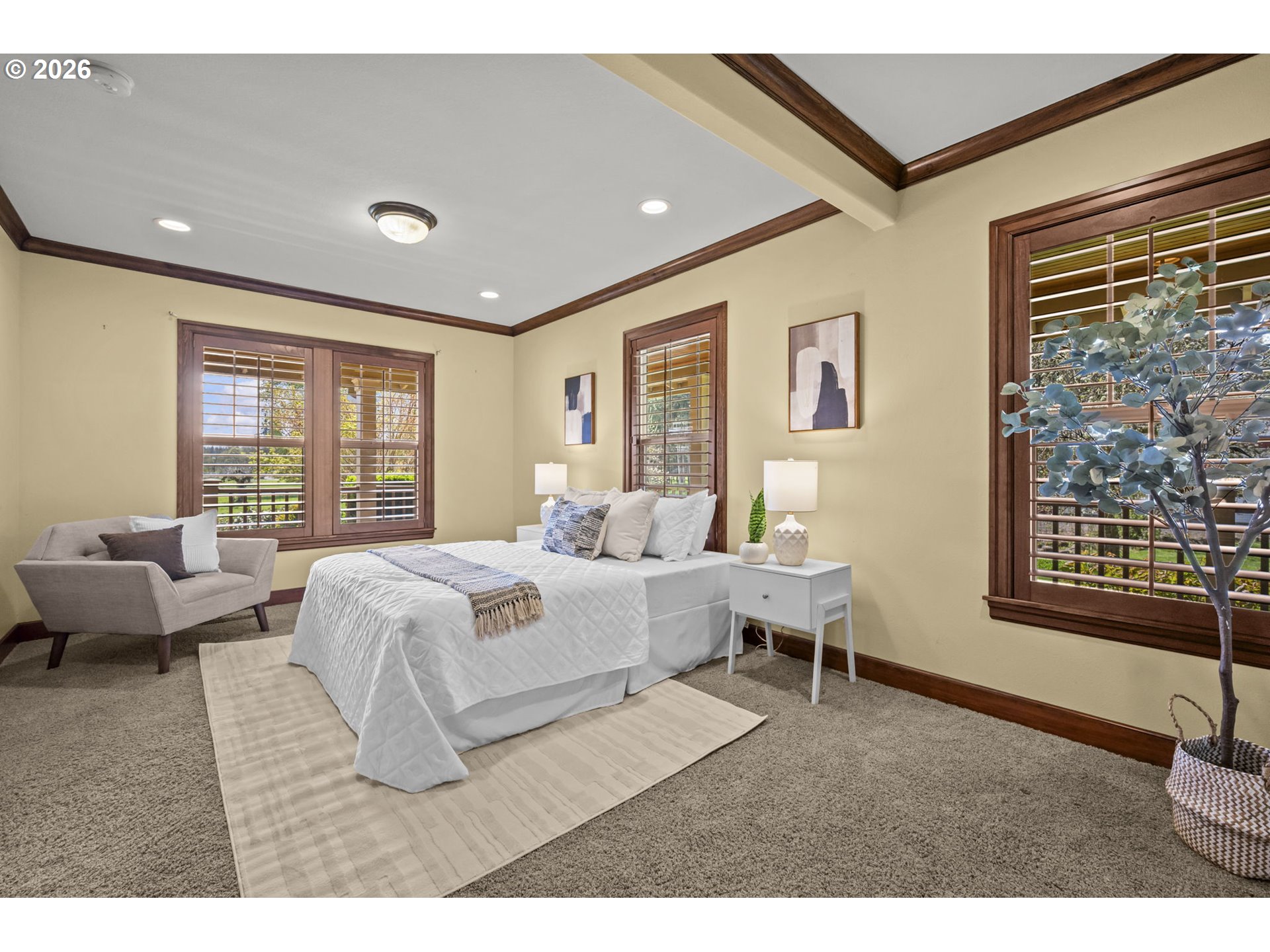 8121 South Vale Garden Road Canby, OR 97013 - Photo 19 of 48 a spacious bedroom with a bed a couch and a window