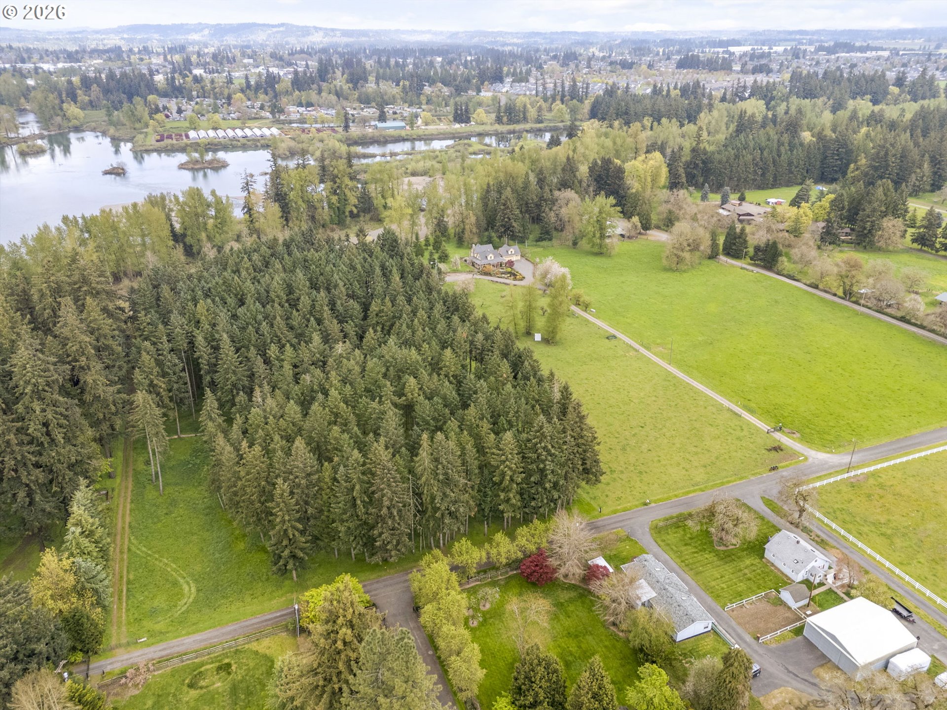 8121 South Vale Garden Road Canby, OR 97013 - Photo 2 of 48 a view of a lake with a city