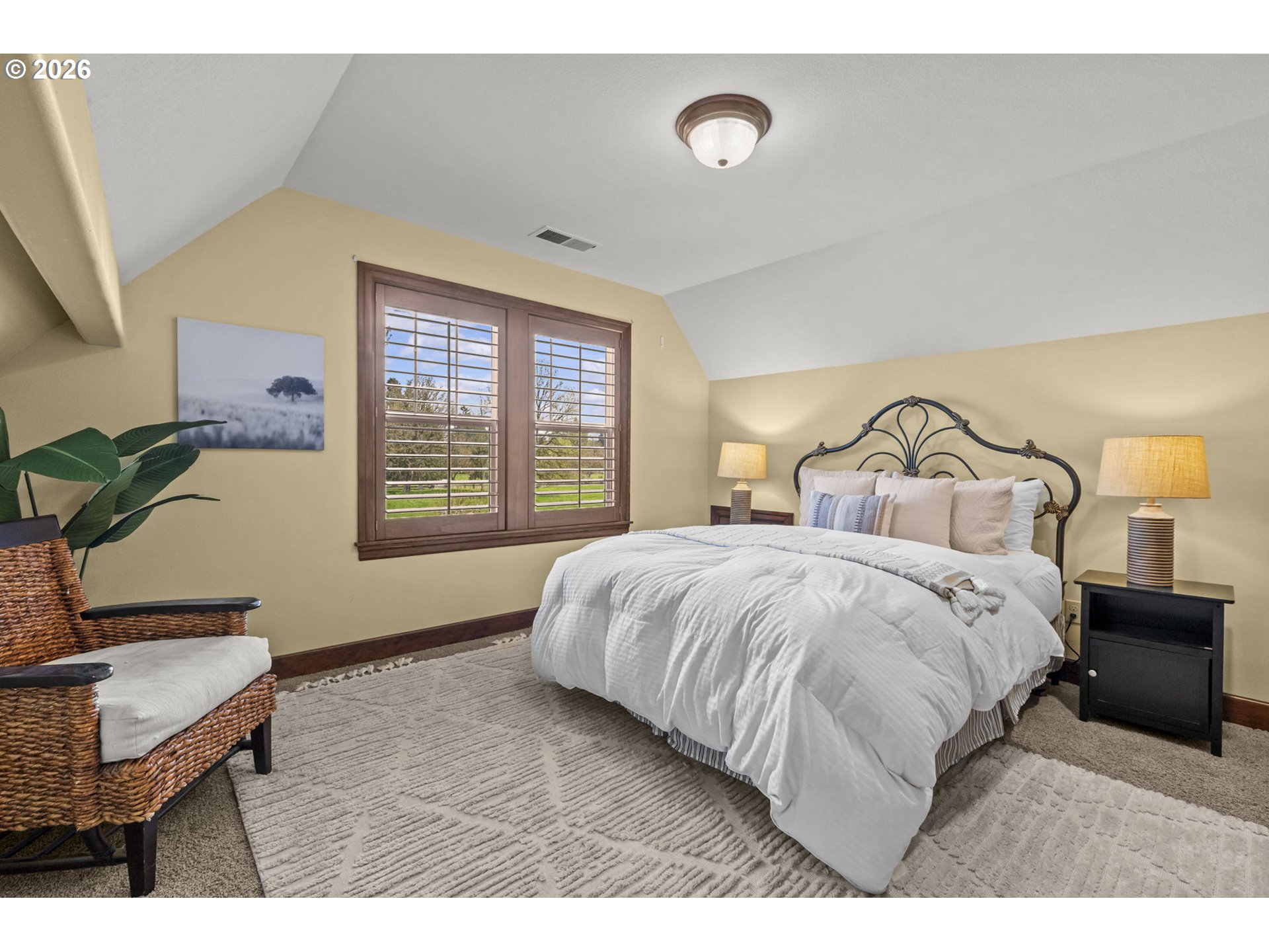 8121 South Vale Garden Road Canby, OR 97013 - Photo 32 of 48 a bedroom with a bed a table and chair