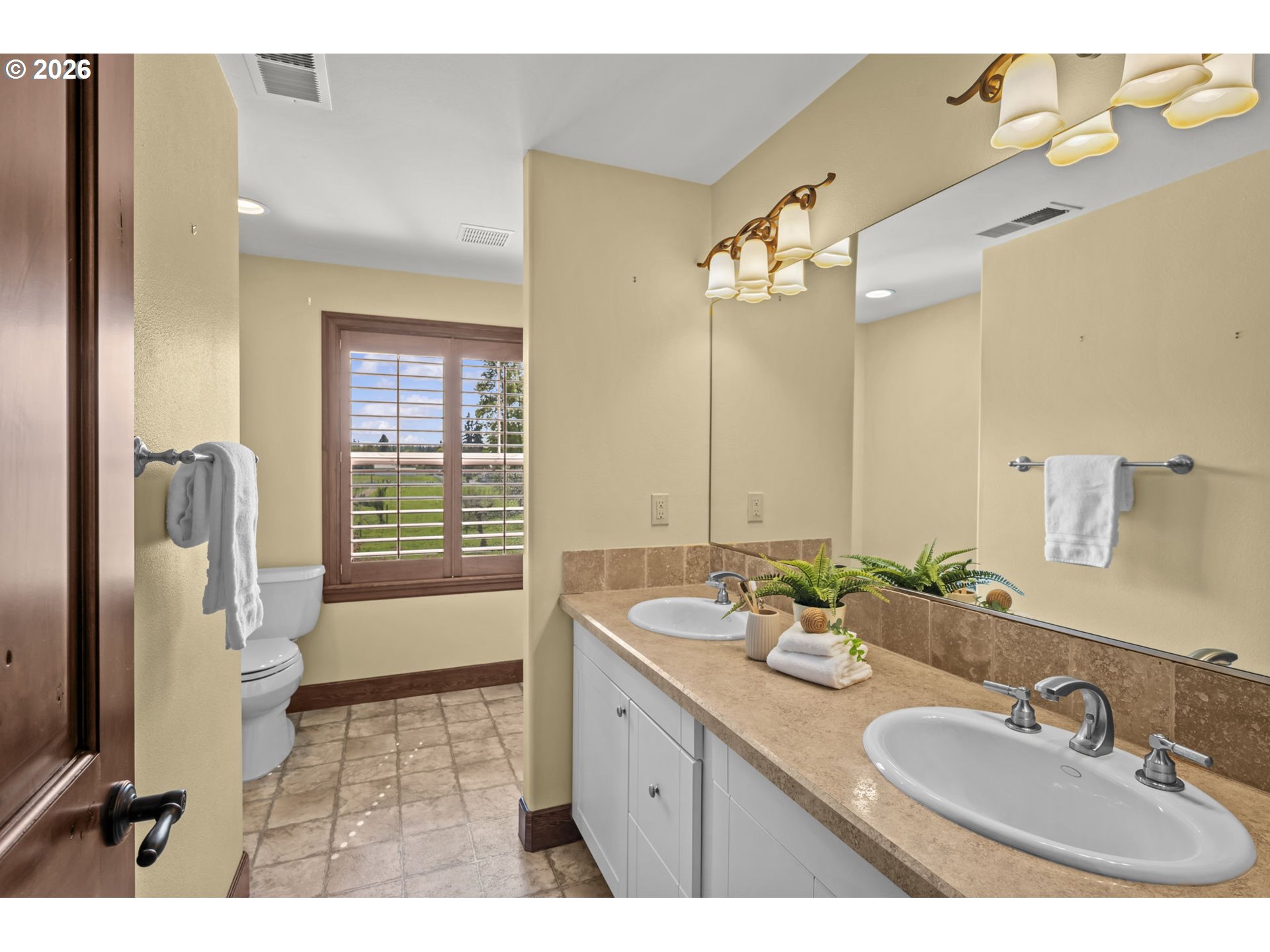 8121 South Vale Garden Road Canby, OR 97013 - Photo 33 of 48 a bathroom with a double vanity sink a mirror and a shower