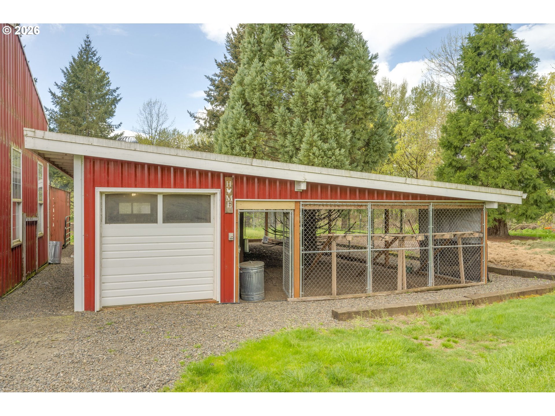 8121 South Vale Garden Road Canby, OR 97013 - Photo 41 of 48 a front view of a house with a garden