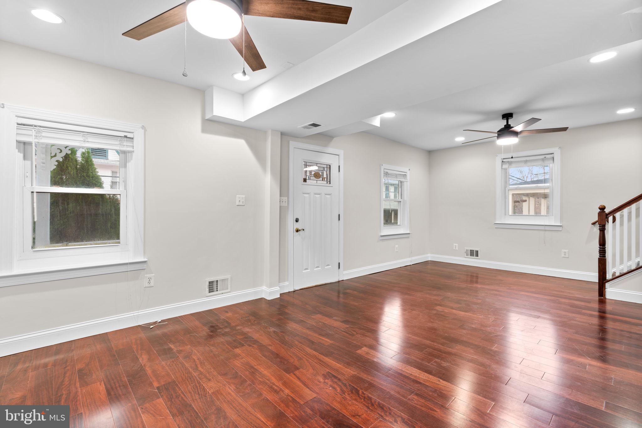 8483 Frederick Road Ellicott City, MD 21043 - Photo 6 of 45 Main level; entertainment area/dining area.