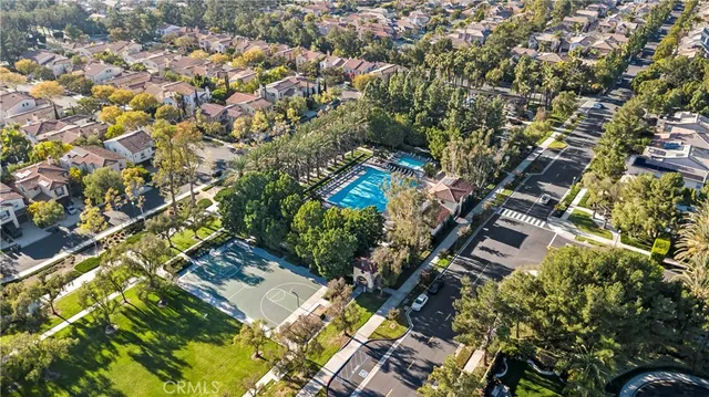 an aerial view of residential building and car parked