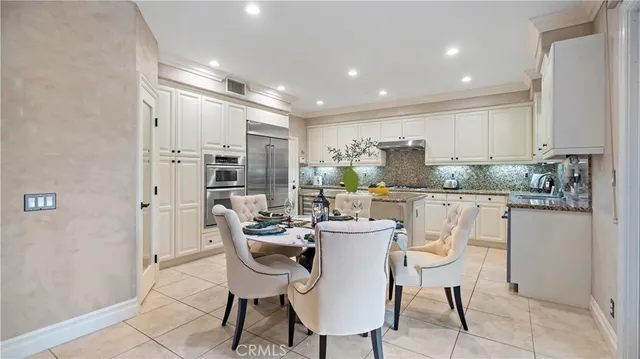 a dining room with furniture a window and kitchen view