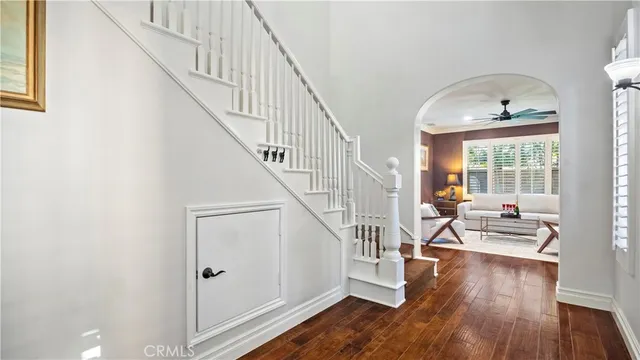 a view of entryway and hall with wooden floor
