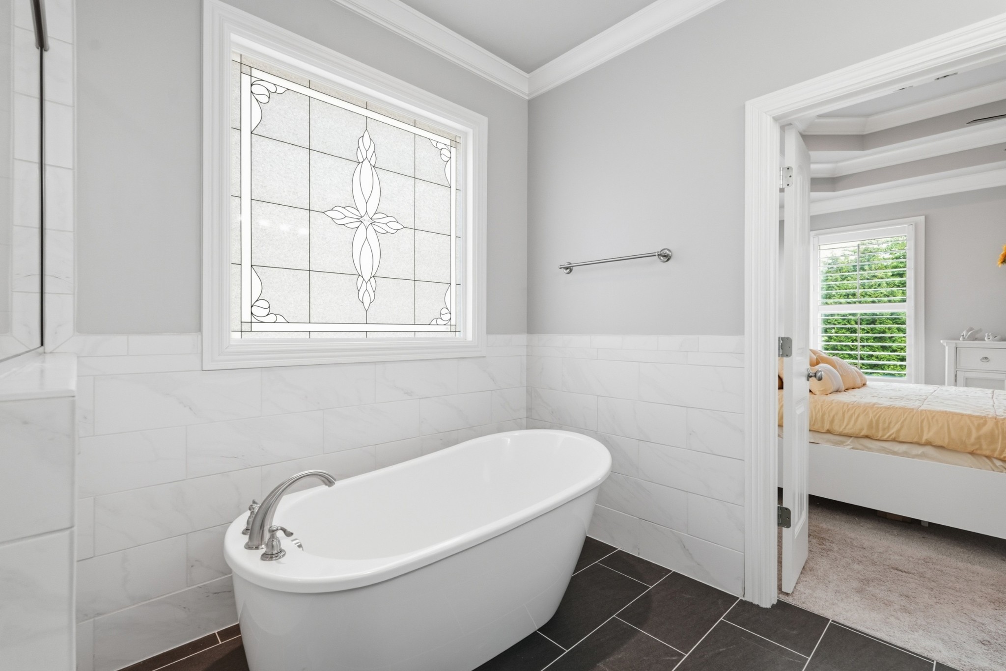 6000 Wallaby Court Spring Hill, TN 37174 - Photo 26 of 57 a bathroom with a white tub shower and sink