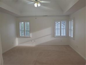 3715 Ridgeside Court Suwanee, GA 30024 - Photo 27 of 44 an empty room with windows and fan