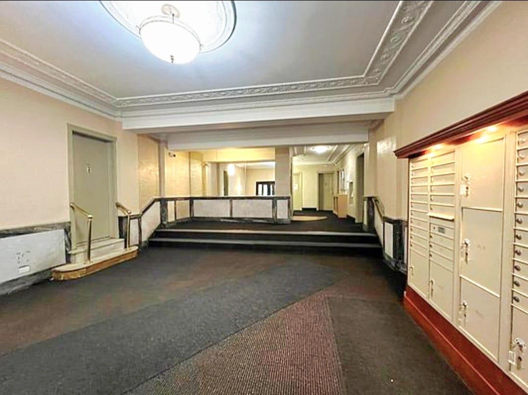 83-64 Talbot Street, Unit 4B Queens, NY 11415 - Photo 14 of 16 a view of a room with gym equipment