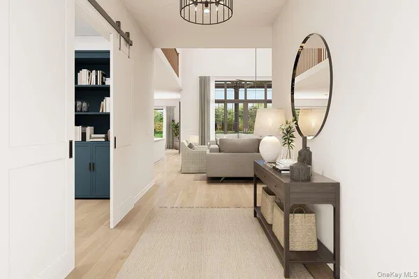 a living room with furniture a table and a large window
