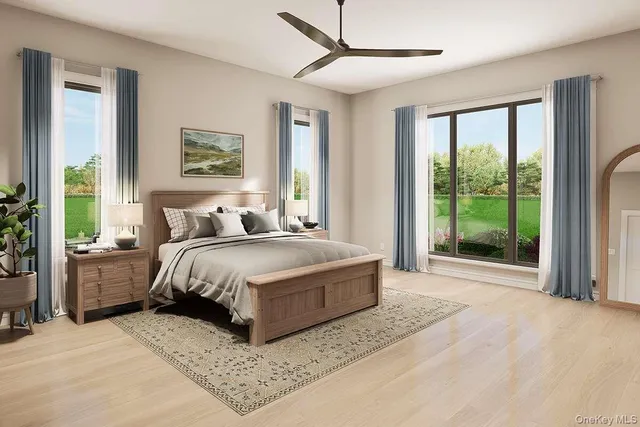 a spacious bedroom with a large bed and a large window