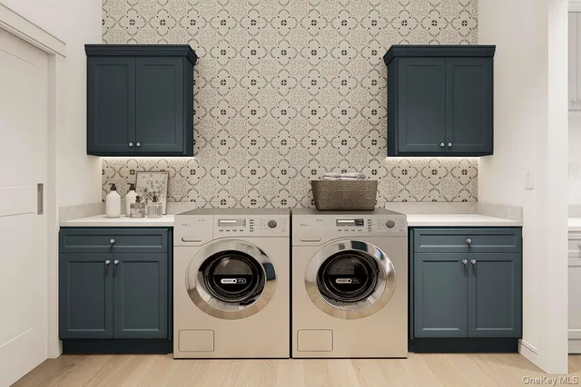 a utility room with sink washer and dryer
