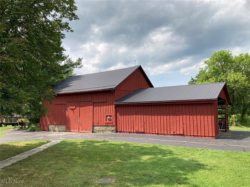 8309 Drake State Line Road Masury, OH 44438 - Photo 12 of 34 View of outdoor structure with a lawn