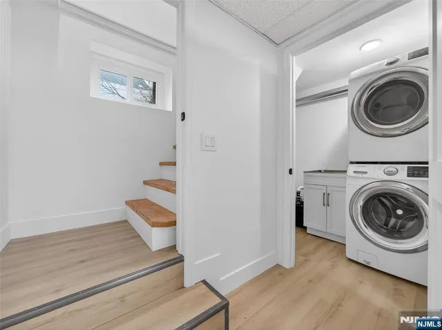 a view of a hallway with washer and dryer