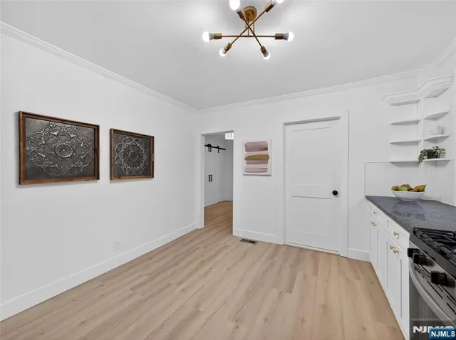 a view of a livingroom with wooden floor and closet