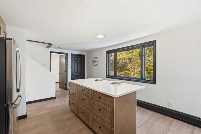 a kitchen with a sink stove and microwave