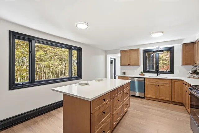a kitchen with a sink and a window