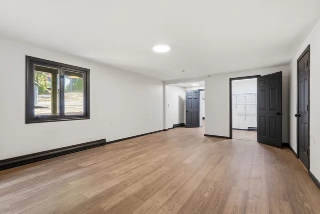 a spacious bathroom with a double vanity sink and a mirror