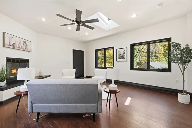 a dining room with furniture and wooden floor