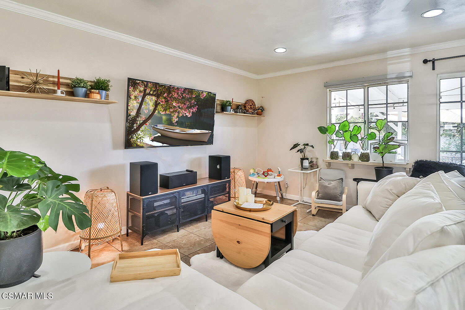 1776 Cochran Street Simi Valley, CA 93065 - Photo 13 of 43 a living room with furniture a flat screen tv and a fireplace