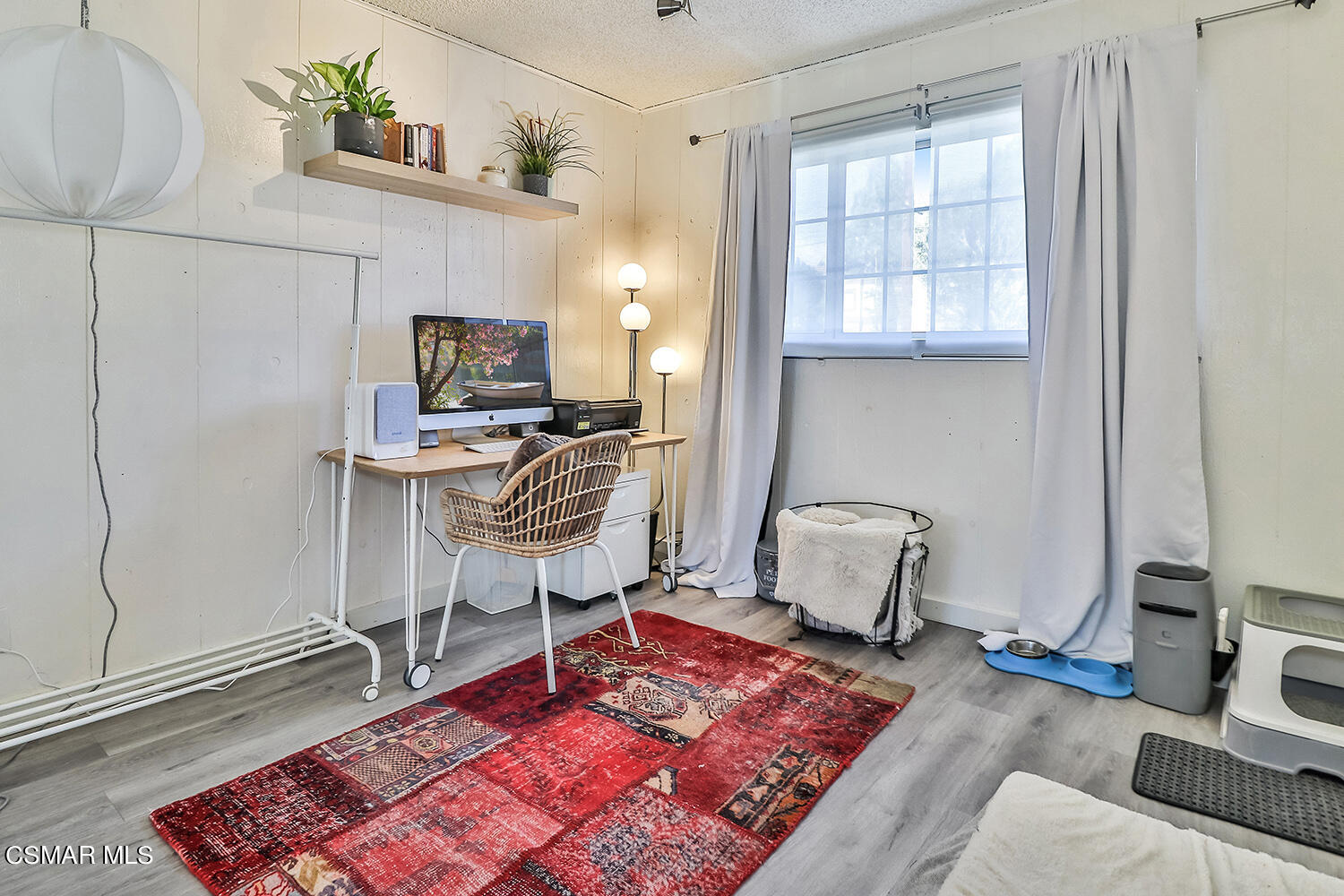 1776 Cochran Street Simi Valley, CA 93065 - Photo 16 of 43 a living room with furniture and a flat screen tv