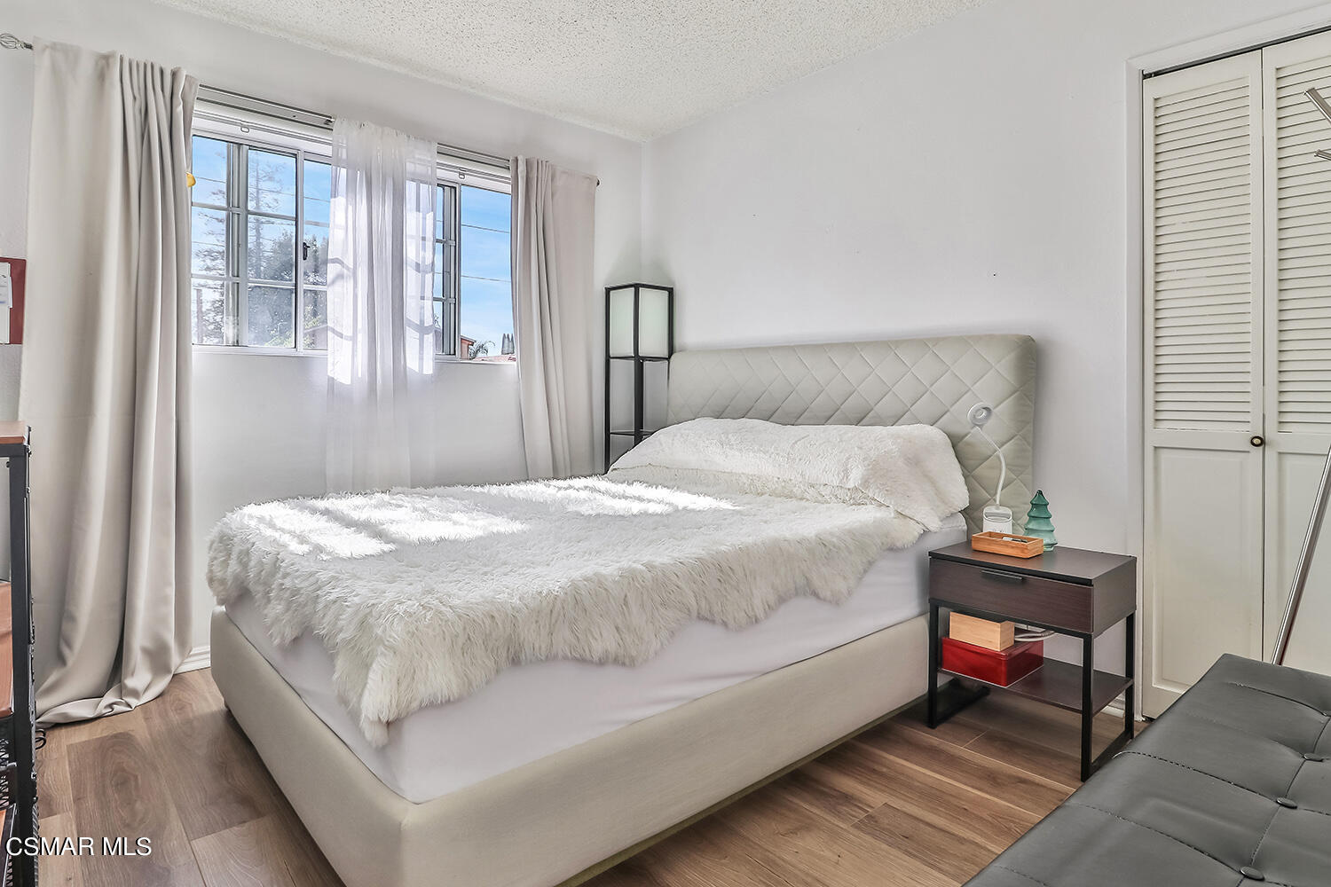 1776 Cochran Street Simi Valley, CA 93065 - Photo 18 of 43 a bed sitting in a bedroom next to a window