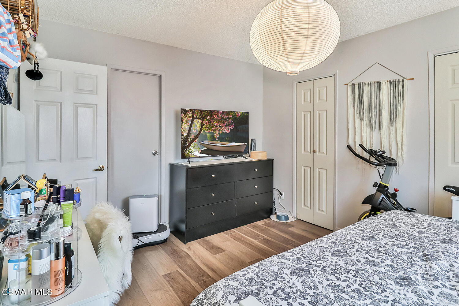 1776 Cochran Street Simi Valley, CA 93065 - Photo 21 of 43 a bedroom with a bed and a chandelier