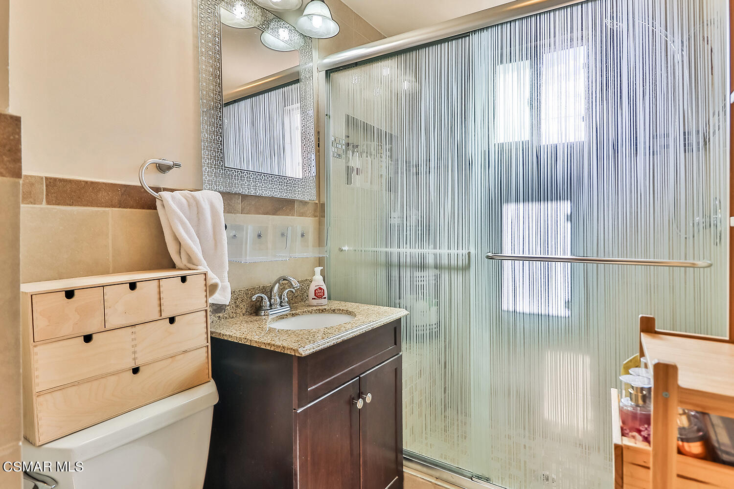 1776 Cochran Street Simi Valley, CA 93065 - Photo 23 of 43 a bathroom with a sink and a mirror