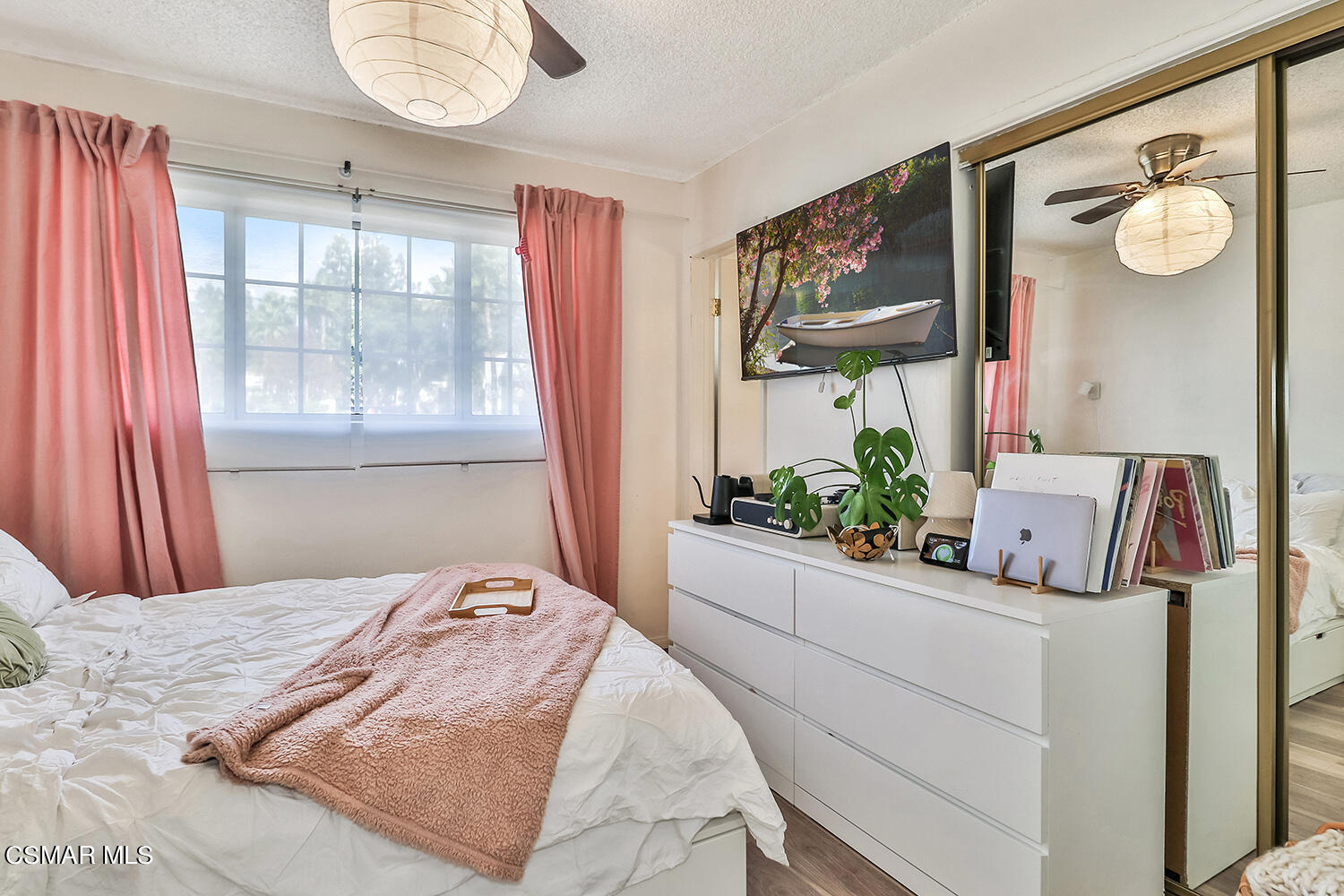 1776 Cochran Street Simi Valley, CA 93065 - Photo 25 of 43 a bedroom with a bed and dresser with mirror