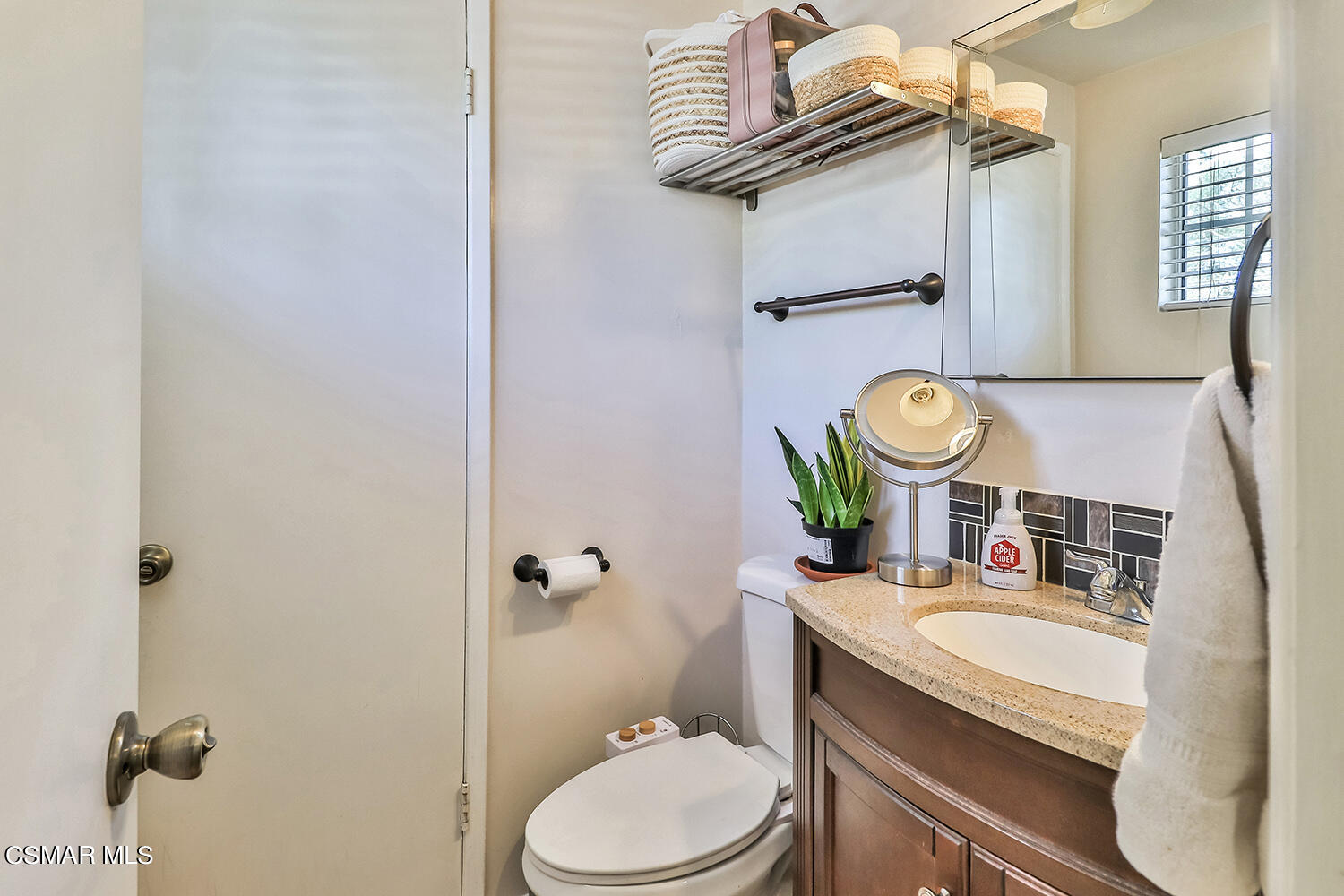 1776 Cochran Street Simi Valley, CA 93065 - Photo 27 of 43 a bathroom with a sink toilet mirror