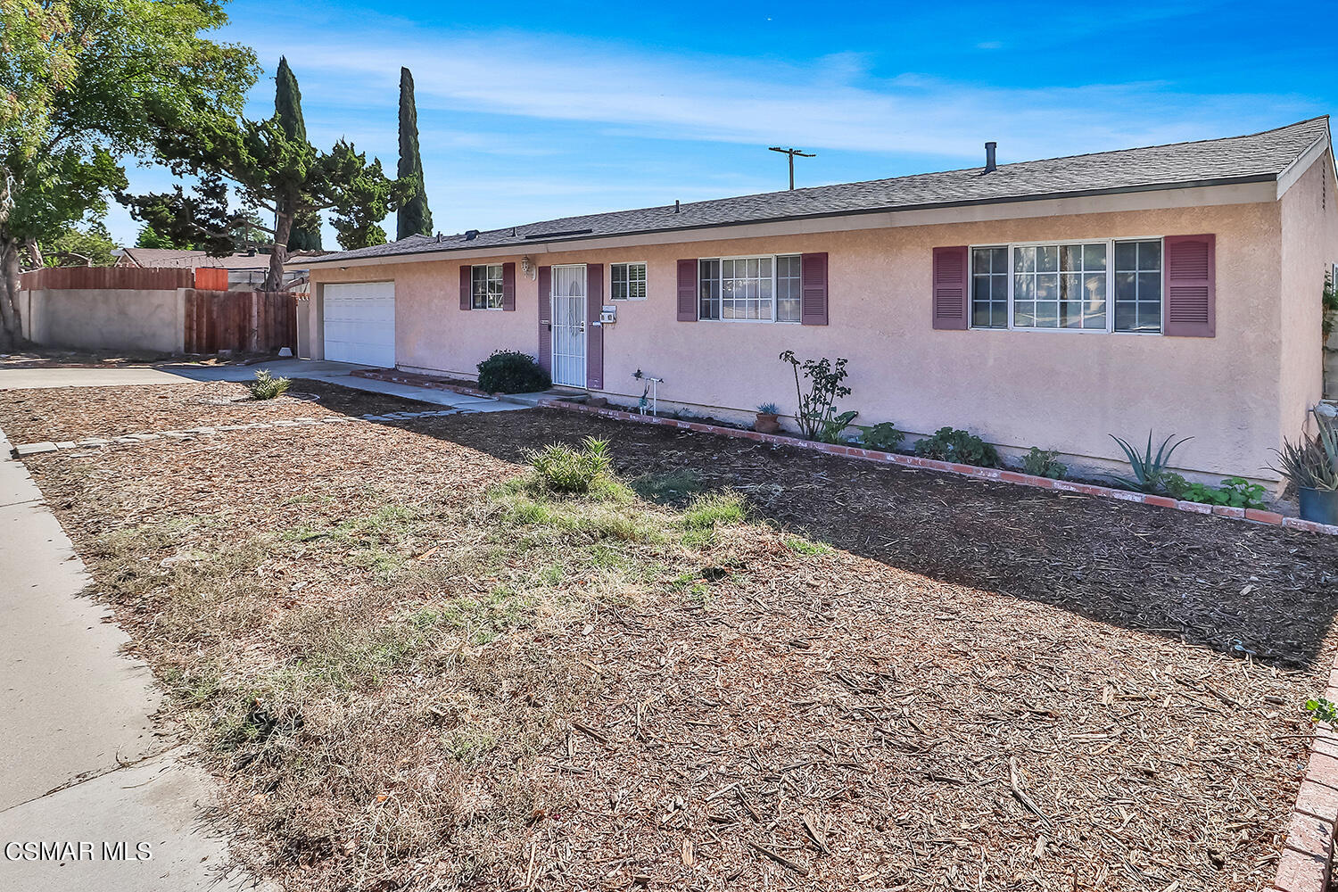 1776 Cochran Street Simi Valley, CA 93065 - Photo 3 of 43 a front view of a house with garden
