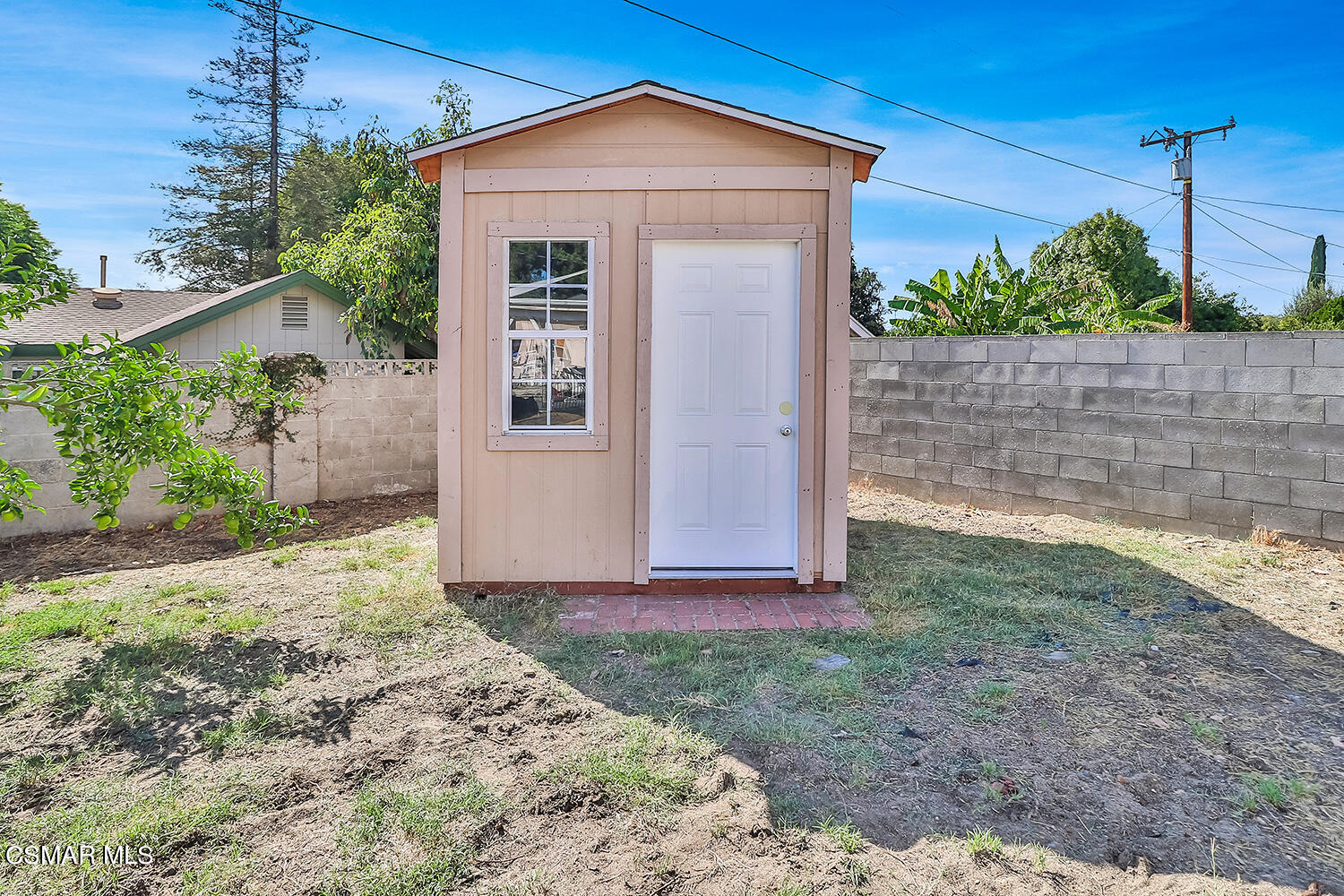 1776 Cochran Street Simi Valley, CA 93065 - Photo 32 of 43 a view of a house with a yard