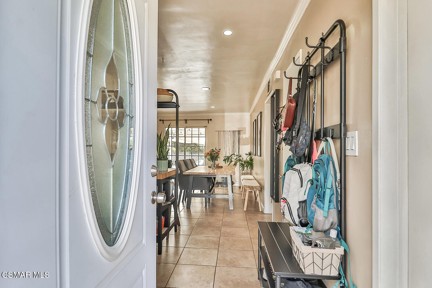 1776 Cochran Street Simi Valley, CA 93065 - Photo 5 of 43 a view of a hallway with dining area chandelier and glass door
