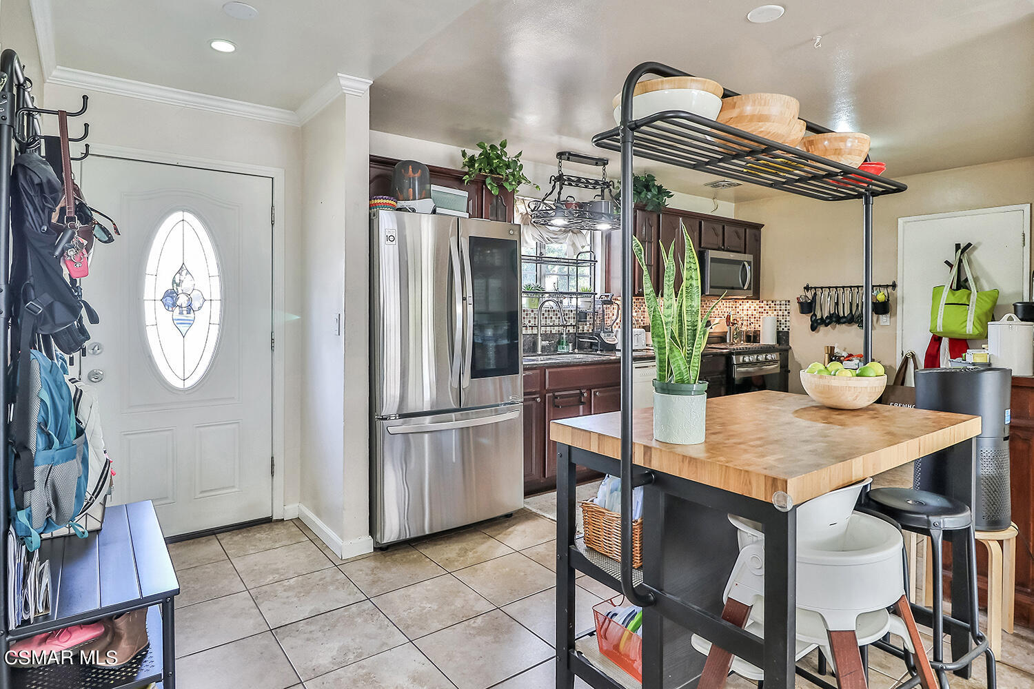 1776 Cochran Street Simi Valley, CA 93065 - Photo 6 of 43 a view of a dining room with furniture and a chandelier