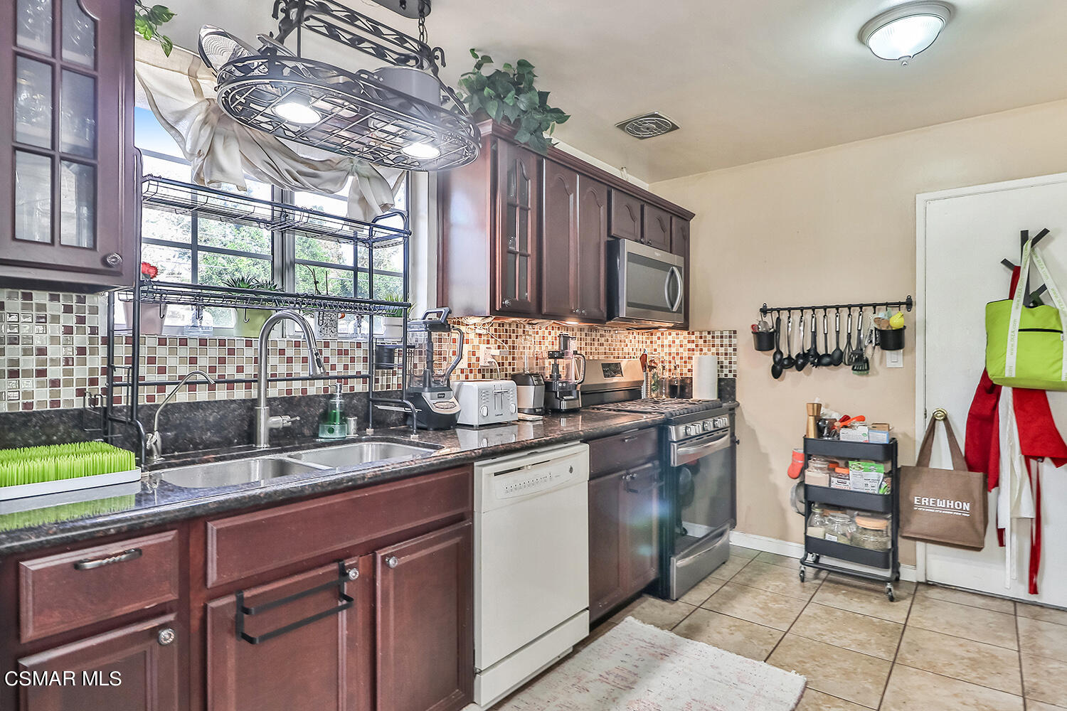 1776 Cochran Street Simi Valley, CA 93065 - Photo 8 of 43 a kitchen with a sink and cabinets