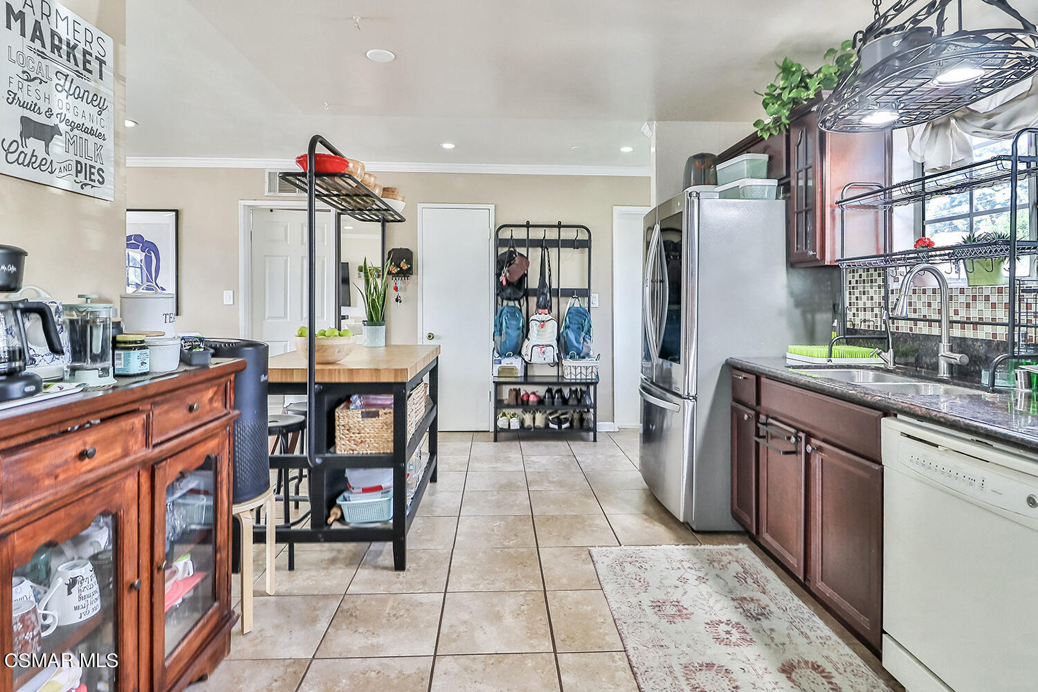 1776 Cochran Street Simi Valley, CA 93065 - Photo 9 of 43 a kitchen with stainless steel appliances granite countertop a refrigerator and a sink