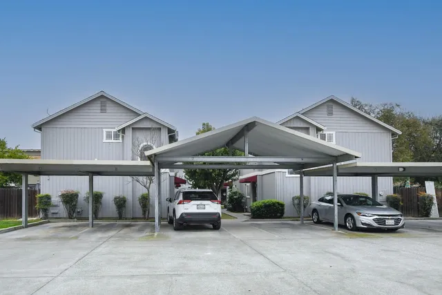 a view of a car parked in front of a house