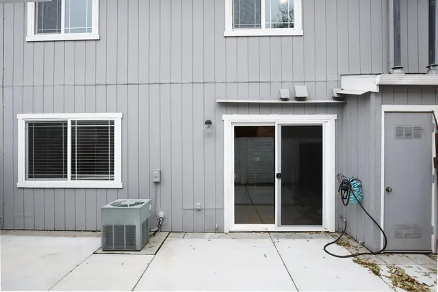 a front view of a house with a potted plant