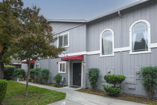 a front view of a house with garden