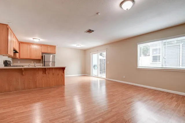 a view of kitchen with wooden floor and window