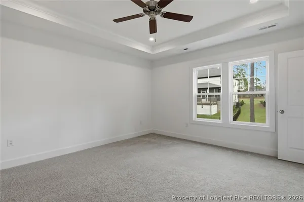 a bathroom with a granite countertop sink a mirror and a shower