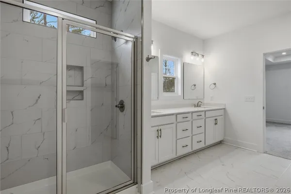 a bathroom with a sink a toilet a mirror and vanity