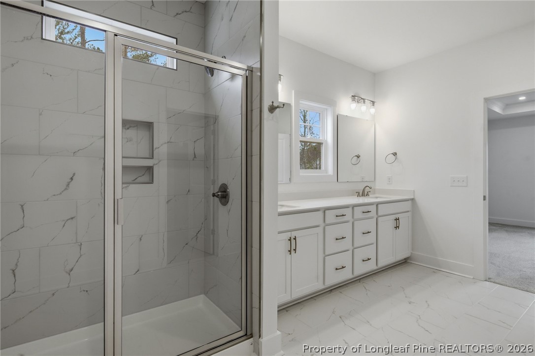 96 Graduate Ct Spring Lake Spring Lake, NC 28390 - Photo 15 of 49 a bathroom with a double vanity sink mirror and shower