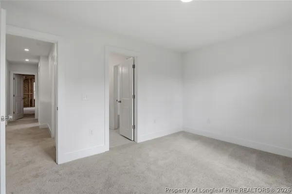 a view of a lake with a house in the background