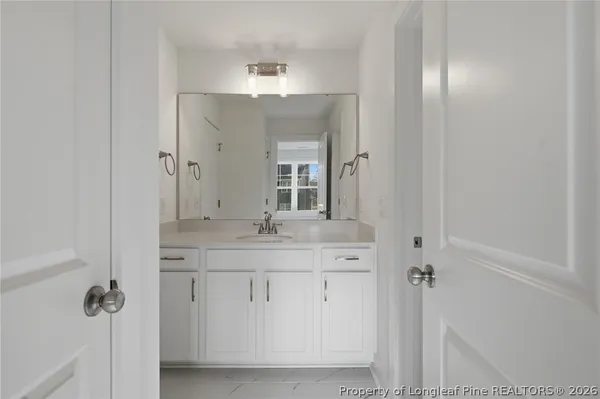 a view of roof deck with dining table and chairs