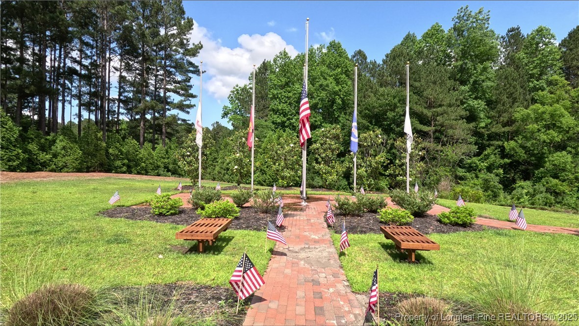 96 Graduate Ct Spring Lake Spring Lake, NC 28390 - Photo 29 of 33 a view of a chair and tables in the garden